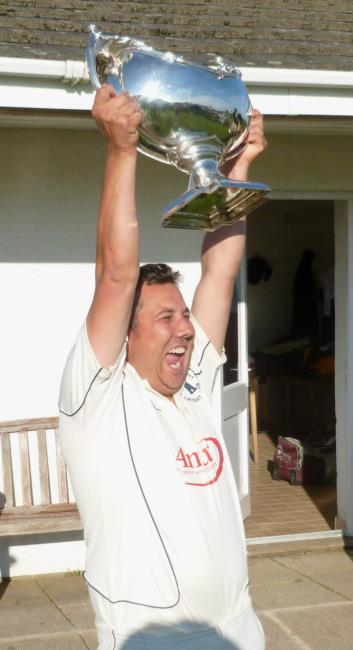 A delighted Potts raises The Bowl aloft